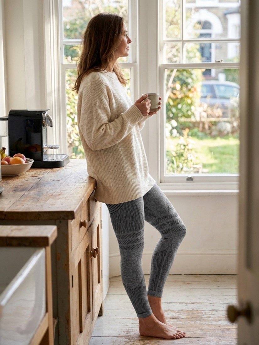 Woman wearing black high-waisted 3D compression leggings